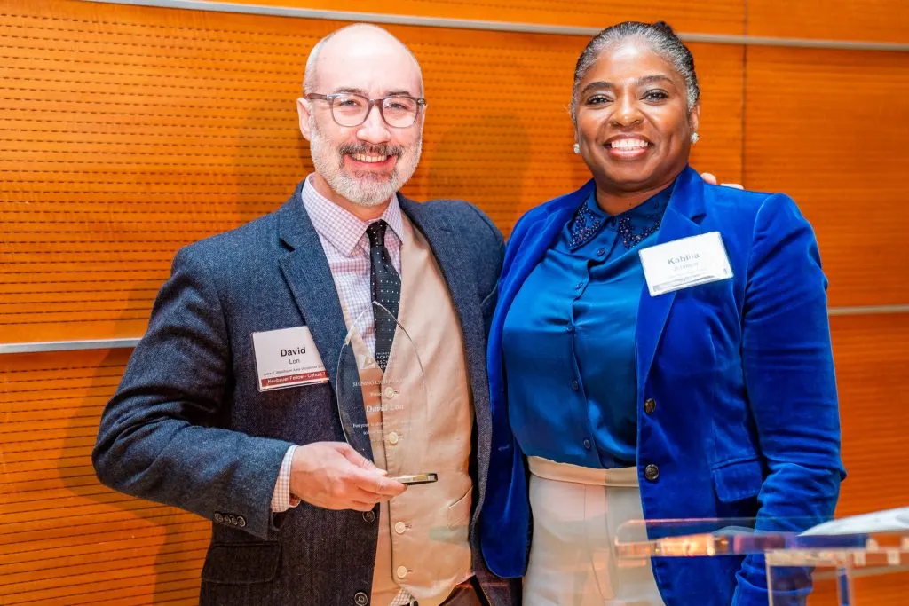 David Lon receives the Shining Light Award from Dr. Kahlila Johnson